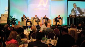 Automotive journalist Lindsay Chappell, appropriate, conducts an AutoVision conference conversation of “The upcoming ten years in car business” with, from left, Yoshimasa Ogino of Akebono Brakes, Chris Nielsen of Toyota, and Tom Kroskey of General Motors.