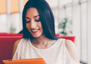 woman utilizing a tablet