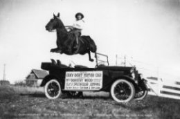 skip Dorothy Wood along with her horse jumping over a Gray-Dort car