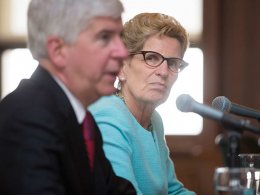Ontario Premier, Kathleen Wynne, holds a press conference with Michigan Governor, Rick Snyder, left, in the Cadillac Building in Detroit, Mich., Wednesday, June 15, 2016.