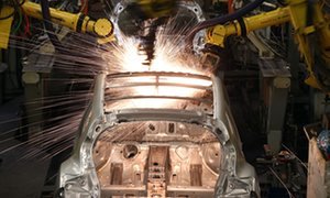 Robotic arms assemble and weld your body layer of a Nissan car from the production line at Nissan's Sunderland plant