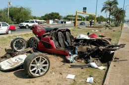 Wreckage associated with deluxe sports vehicle after yesterday's accident.